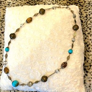 Necklace with turquoise and old gold.